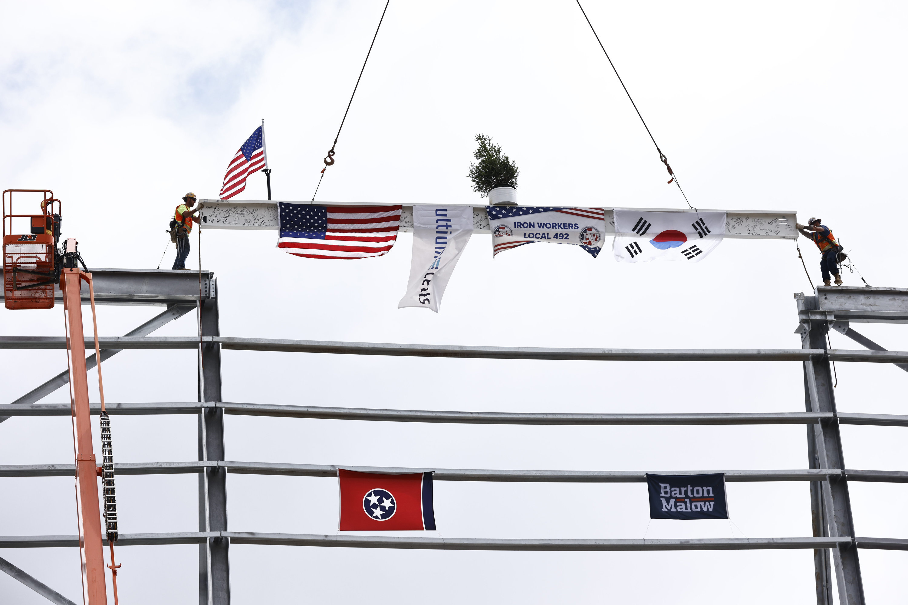 Ironworkers and construction partners at the Ultium Cells battery cell manufacturing facility install the final beam as part of a traditional “topping out” ceremony Wednesday, June 8, 2022 in Spring Hill, Tennessee. Photo by Wade Payne for Ultium Cells.