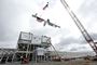 Ironworkers and construction partners at the Ultium Cells battery cell manufacturing facility install the final beam as part of a traditional “topping out” ceremony Wednesday, June 8, 2022 in Spring Hill, Tennessee. Photo by Wade Payne for Ultium Cells.