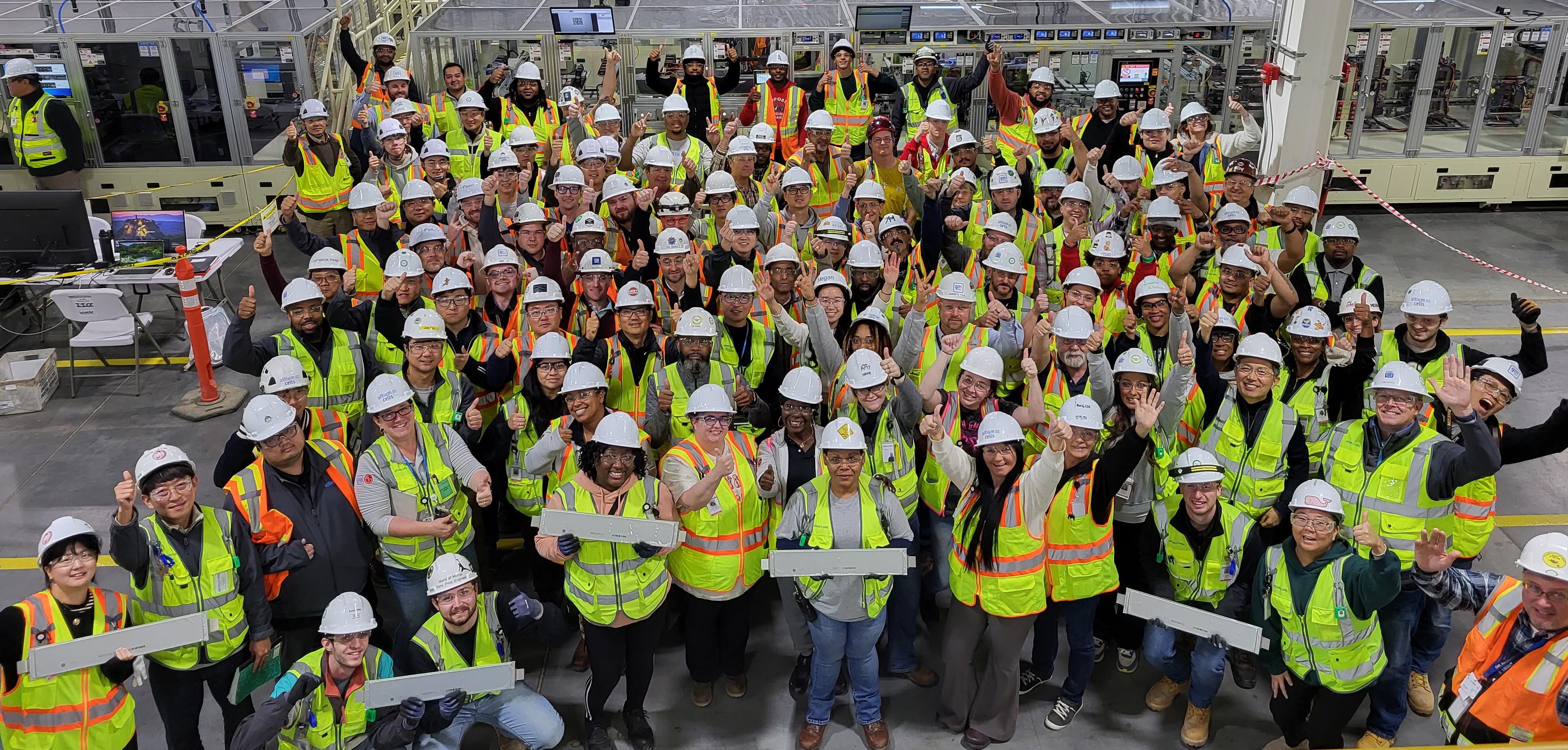 Volunteers standing behind table of food and beverages